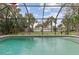 Screened pool with landscaping and privacy at 20191 Rutherford Ave, Port Charlotte, FL 33952