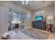 Relaxing sunroom with ceiling fan and exterior access to the backyard at 2982 Estancia Pl, Clearwater, FL 33761