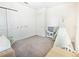 Bright, carpeted bedroom with a play teepee and closet space at 29922 Marquette Ave, Wesley Chapel, FL 33545