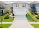 Inviting two-story home showcasing a well-manicured lawn and a convenient two-car garage at 29922 Marquette Ave, Wesley Chapel, FL 33545