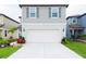 Attractive two-story home with a two-car garage, complemented by a neat lawn at 29922 Marquette Ave, Wesley Chapel, FL 33545