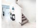 Open foyer with staircase, tiled floor, and elegant decor at 29922 Marquette Ave, Wesley Chapel, FL 33545