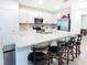 Stylish kitchen featuring a large island with bar seating and modern appliances at 29922 Marquette Ave, Wesley Chapel, FL 33545