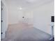 Carpeted loft area with bright light and a desk at 29922 Marquette Ave, Wesley Chapel, FL 33545