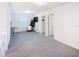 Carpeted loft area with bright light and a desk at 29922 Marquette Ave, Wesley Chapel, FL 33545