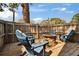 Outdoor wooden deck area with stone fire pit and comfortable seating at 2999 67Th S Ave, St Petersburg, FL 33712