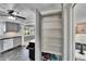 Pantry with shelving provides ample storage space in the updated kitchen at 2999 67Th S Ave, St Petersburg, FL 33712