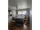Cozy bedroom with a ceiling fan, wood floors, and natural light from the window at 3301 Alt 19 # 700, Palm Harbor, FL 34683