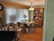Charming dining area with a round table, seating for four, and a vintage hutch at 3301 Alt 19 # 700, Palm Harbor, FL 34683