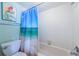 This bathroom has a combined tub and shower with a beach-themed shower curtain at 5505 Puerta Del Sol S Blvd # 428, St Petersburg, FL 33715