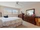 Inviting bedroom with ample natural light, wooden dressers, and a decorative quilt bedspread at 5575 Gulf Blvd # 332, St Pete Beach, FL 33706