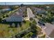 A street view of the community with palm trees lining the sidewalks at 582 Ozona Village Dr, Palm Harbor, FL 34683