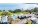Scenic community aerial view highlighting a clubhouse, community pool, and shuffleboard courts at 585 Sky Harbor Dr # 416, Clearwater, FL 33759