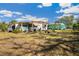 Spacious backyard offering ample lawn and a charming patio area at 585 Sky Harbor Dr # 416, Clearwater, FL 33759