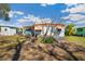 Backyard featuring ample lawn and a charming patio area at 585 Sky Harbor Dr # 416, Clearwater, FL 33759