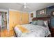 Bedroom featuring a large bed, spacious closets, and a peaceful, airy atmosphere at 585 Sky Harbor Dr # 416, Clearwater, FL 33759