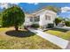 Cozy single-story home with a well-kept lawn and a charming walkway to the entrance at 585 Sky Harbor Dr # 416, Clearwater, FL 33759