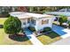 Charming home featuring a well-manicured front yard and driveway at 585 Sky Harbor Dr # 416, Clearwater, FL 33759