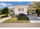 Inviting single-story home featuring a covered parking space and tidy front yard at 585 Sky Harbor Dr # 416, Clearwater, FL 33759