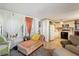 Open layout featuring a chaise lounge, kitchen with white cabinets and contrasting backsplash at 585 Sky Harbor Dr # 416, Clearwater, FL 33759
