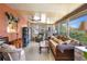 Inviting sunroom with plenty of natural light, comfortable seating, and charming decor at 585 Sky Harbor Dr # 416, Clearwater, FL 33759
