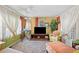 Cozy living room with a TV, comfortable seating, and a large window at 585 Sky Harbor Dr # 416, Clearwater, FL 33759