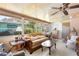 Cozy sunroom featuring large windows, a comfortable sofa, and ample natural light at 585 Sky Harbor Dr # 416, Clearwater, FL 33759