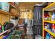 Small storage room with yellow walls and shelves stacked with household items at 585 Sky Harbor Dr # 416, Clearwater, FL 33759