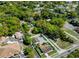 Aerial view of the property showcasing its layout, landscaping, and surrounding neighborhood at 6213 Sheldon Rd, Tampa, FL 33615