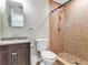 A simple bathroom featuring a tiled shower and granite topped vanity at 6213 Sheldon Rd, Tampa, FL 33615