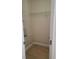Walk-in closet with shelving and tiled flooring for organized storage at 6213 Sheldon Rd, Tampa, FL 33615