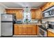 Well-equipped kitchen featuring stainless steel appliances, granite countertops, and ample cabinet space at 6213 Sheldon Rd, Tampa, FL 33615