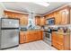 Well-equipped kitchen featuring stainless steel appliances, granite countertops, and ample cabinet space at 6213 Sheldon Rd, Tampa, FL 33615