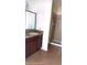 Bathroom features a sleek vanity with a sink, a spacious shower, and modern tiling at 6359 Timberly Ln, Zephyrhills, FL 33542
