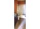 Functional bathroom featuring a shower-tub combo, vanity, and tile flooring at 6359 Timberly Ln, Zephyrhills, FL 33542