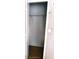 A closet with a door opening and a rod for hanging clothes at 6359 Timberly Ln, Zephyrhills, FL 33542