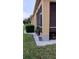 Exterior home shot showcasing a manicured lawn and white gravel landscaping at 6359 Timberly Ln, Zephyrhills, FL 33542