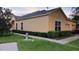 Attractive home with neutral siding, manicured hedges, and a spacious two-car garage at 6359 Timberly Ln, Zephyrhills, FL 33542