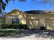 Charming single-story home with a two-car garage and well-maintained landscaping at 6359 Timberly Ln, Zephyrhills, FL 33542