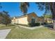 Inviting exterior view of a well-maintained home with a two-car garage and manicured landscaping at 6359 Timberly Ln, Zephyrhills, FL 33542