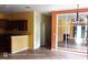 Inviting living room with tile flooring, front door, and large mirror feature wall at 6359 Timberly Ln, Zephyrhills, FL 33542