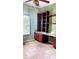 This versatile room has a built-in desk, shelving, and is perfect as a home office or study at 6359 Timberly Ln, Zephyrhills, FL 33542