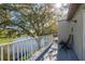Scenic balcony view overlooking the lake, featuring an iron chair at 720 Earls Ct, Safety Harbor, FL 34695