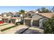 Wide angle exterior showcasing townhouses each with private garages and manicured landscaping at 720 Earls Ct, Safety Harbor, FL 34695