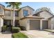 Charming townhouse featuring a one-car garage, well-maintained landscaping, and a welcoming front entrance at 720 Earls Ct, Safety Harbor, FL 34695