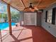 The patio provides shade, seating, and a view of the pool for relaxation and entertainment at 7730 Arlight Dr, New Port Richey, FL 34655