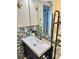 Bathroom vanity with tile backsplash at 8911 Blind Pass Rd # 220, St Pete Beach, FL 33706