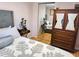 Bedroom featuring hardwood floors and a wardrobe at 8911 Blind Pass Rd # 220, St Pete Beach, FL 33706