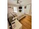 Relaxing bedroom featuring large bed, lots of pillows and hardwood floors at 8911 Blind Pass Rd # 220, St Pete Beach, FL 33706