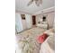 Bedroom with pink walls, a floral quilt, a dresser and a mirror at 8911 Blind Pass Rd # 220, St Pete Beach, FL 33706